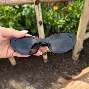 Miu Miu Black Cat-Eye Sunglasses with Dark Lenses